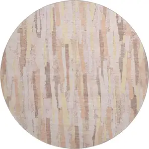 Photo of 8' X 8' Pink Yellow And Peach Striped Washable Round Rug With UV Protection