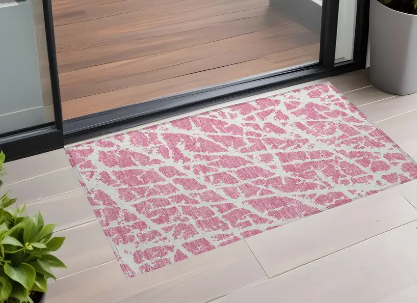 3' X 5' Pink and Ivory Abstract Washable Non Skid Indoor Outdoor Area Rug Photo 1