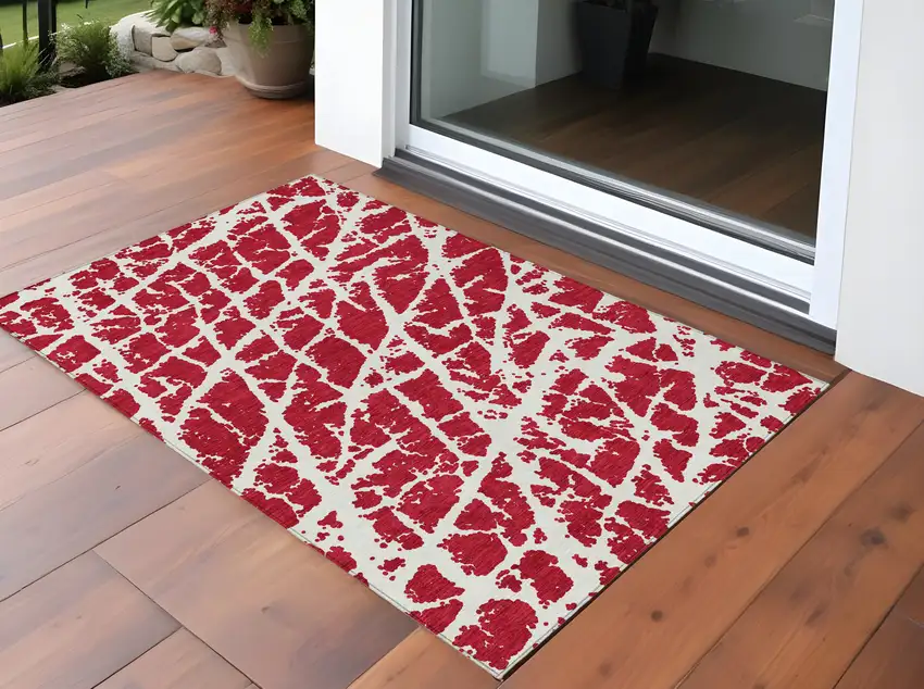 3' X 5' Red and White Abstract Washable Non Skid Indoor Outdoor Area Rug Photo 1
