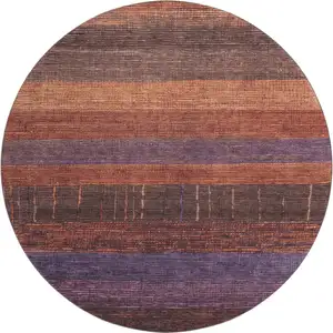 Photo of 8' X 8' Rust Eggplant And Terra Cotta Striped Washable Round Rug With UV Protection