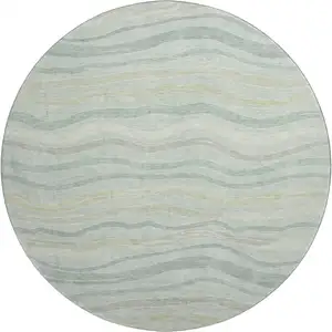 Photo of 8' X 8' Sage Taupe And Ivory Striped Washable Round Rug With UV Protection
