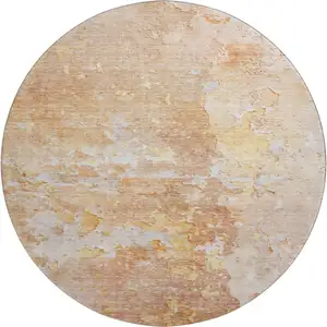 Photo of 8' X 8' Salmon Ivory And Gold Abstract Washable Round Rug With UV Protection