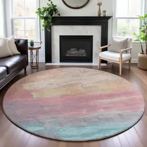 Photo of 8' X 8' Salmon Silver And Teal Abstract Washable Round Rug With UV Protection