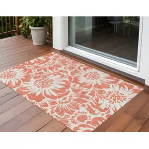 Photo of 3' X 5' Salmon and Ivory Floral Washable Non Skid Indoor Outdoor Area Rug