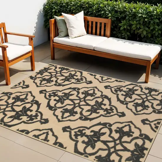 Beige and Black Oriental Stain Resistant Indoor Outdoor Area Rug Photo 1
