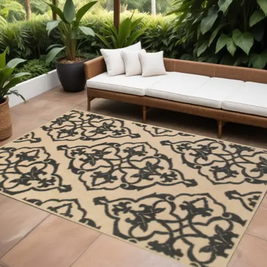 Beige and Black Oriental Stain Resistant Indoor Outdoor Area Rug Photo 1