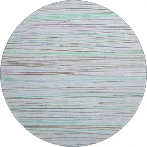 Photo of 8' X 8' Sky Blue Green And Purple Striped Washable Round Rug With UV Protection