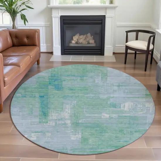 8' X 8' Sky Blue Ivory And Teal Abstract Washable Round Rug With UV Protection Photo 4