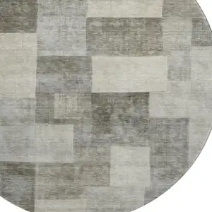 Photo of 8' X 8' Taupe Ivory And Khaki Geometric Washable Round Rug With UV Protection