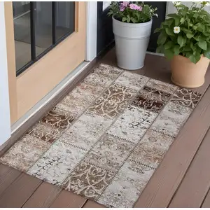 Photo of 3' X 5' Taupe and Ivory Patchwork Washable Non Skid Indoor Outdoor Area Rug
