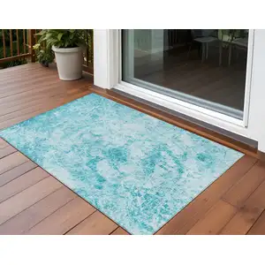 Photo of 3' X 5' Teal Abstract Washable Non Skid Indoor Outdoor Area Rug