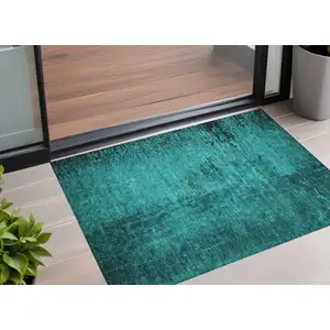 Photo of 3' X 5' Teal Abstract Washable Non Skid Indoor Outdoor Area Rug