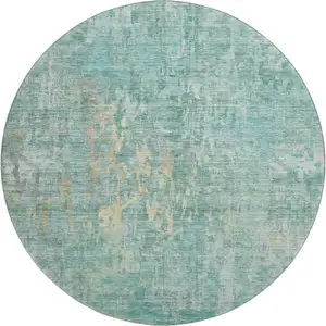 Photo of 8' X 8' Teal And Gold Abstract Washable Round Rug With UV Protection