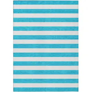 Photo of 3' X 4' Teal Striped Washable Non Skid Indoor Outdoor Area Rug