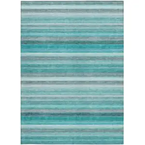 Photo of 3' X 5' Teal Striped Washable Non Skid Indoor Outdoor Area Rug