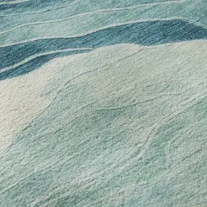 Photo of 8' X 8' Turquoise And Ivory Striped Washable Round Rug With UV Protection