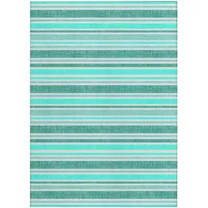 Photo of 3' X 5' Turquoise Striped Washable Non Skid Indoor Outdoor Area Rug