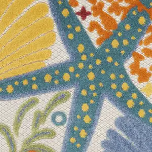 Photo of 2' X 6' Yellow And Teal Animal Print Non Skid Indoor Outdoor Runner Rug