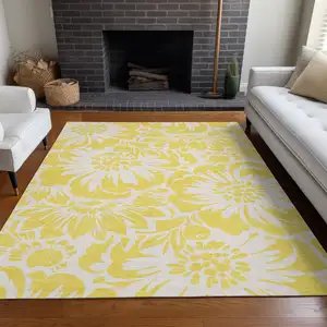 Photo of 3' X 5' Yellow and Ivory Floral Washable Non Skid Indoor Outdoor Area Rug