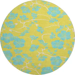 Photo of 8' Yellow And Aqua Floral Washable Round Rug With UV Protection