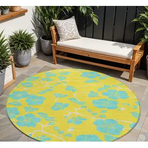 Photo of 8' Yellow And Aqua Round Floral Washable Indoor Outdoor Area Rug