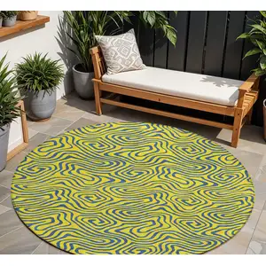 Photo of 8' Yellow And Blue Round Abstract Washable Indoor Outdoor Area Rug