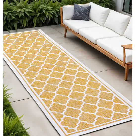 8' Yellow And Cream Geometric Indoor Outdoor Runner Rug Photo 1