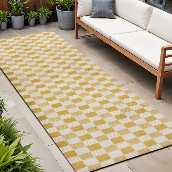 8' Yellow And Cream Geometric Indoor Outdoor Runner Rug Photo 1