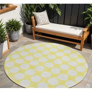 Photo of 8' Yellow And Gray Round Polka Dot Washable Indoor Outdoor Area Rug