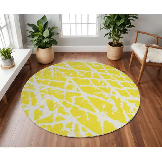 8' Yellow And Ivory Abstract Washable Round Rug With UV Protection Photo 2