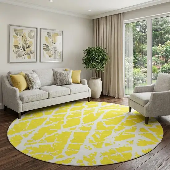 8' Yellow And Ivory Abstract Washable Round Rug With UV Protection Photo 1