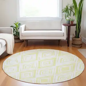 Photo of 8' Yellow And Ivory Diamond Washable Round Rug With UV Protection