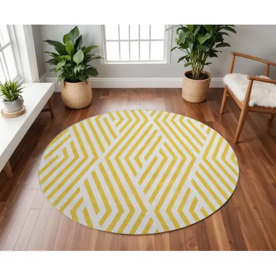 8' Yellow And Ivory Geometric Washable Round Rug With UV Protection Photo 2
