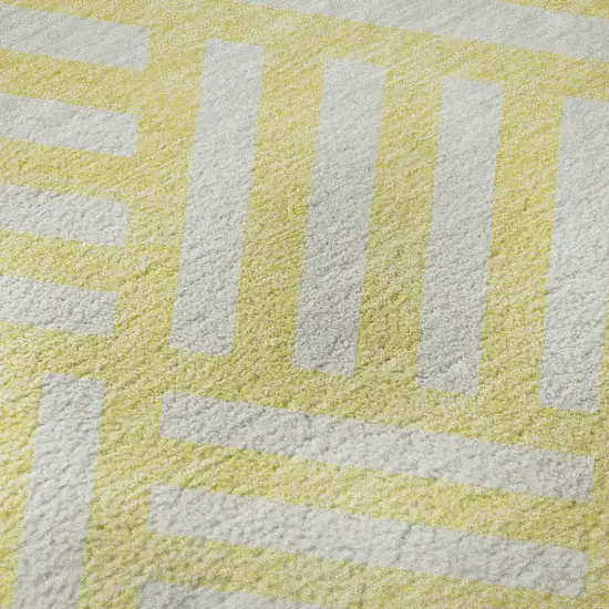 8' Yellow And Ivory Geometric Washable Round Rug With UV Protection Photo 9