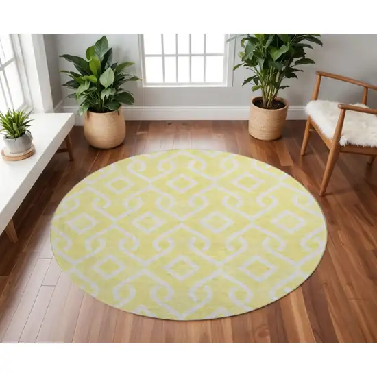 8' Yellow And Ivory Geometric Washable Round Rug With UV Protection Photo 2
