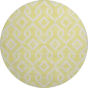 Photo of 8' Yellow And Ivory Geometric Washable Round Rug With UV Protection