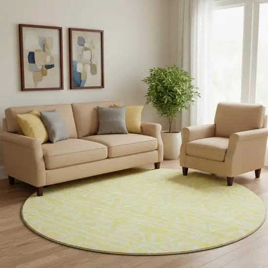 8' Yellow And Ivory Geometric Washable Round Rug With UV Protection Photo 1