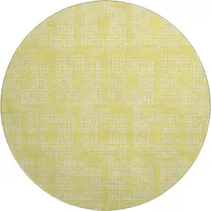 Photo of 8' Yellow And Ivory Geometric Washable Round Rug With UV Protection