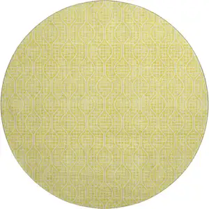 Photo of 8' Yellow And Ivory Geometric Washable Round Rug With UV Protection