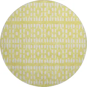 Photo of 8' Yellow And Ivory Geometric Washable Round Rug With UV Protection