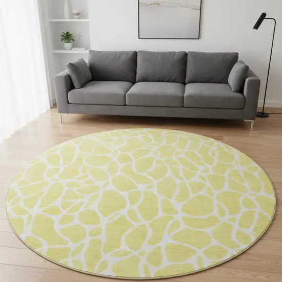 8' Yellow And Ivory Geometric Washable Round Rug With UV Protection Photo 2