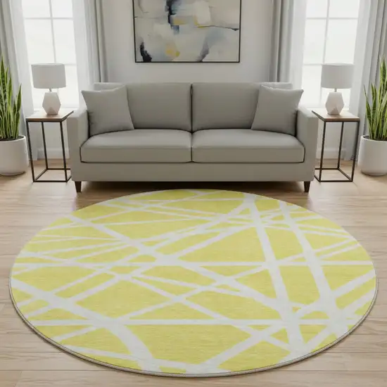8' Yellow And Ivory Geometric Washable Round Rug With UV Protection Photo 2