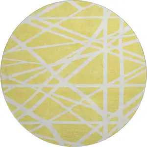 Photo of 8' Yellow And Ivory Geometric Washable Round Rug With UV Protection