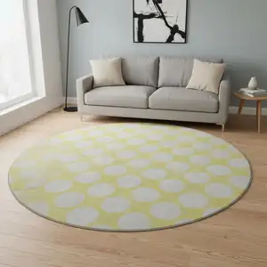 Photo of 8' Yellow And Ivory Polka Dot Washable Round Rug With UV Protection
