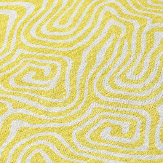 8' Yellow And Ivory Round Abstract Washable Indoor Outdoor Area Rug Photo 4