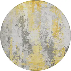 Photo of 8' Yellow And Ivory Round Abstract Washable Indoor Outdoor Area Rug