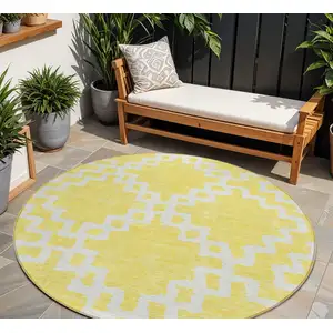 Photo of 8' Yellow And Ivory Round Geometric Washable Indoor Outdoor Area Rug