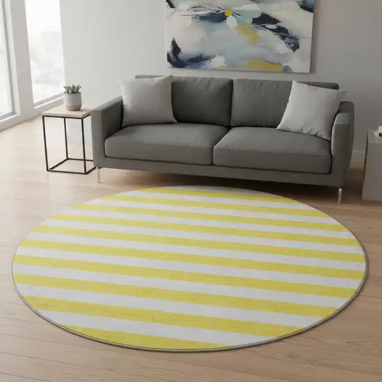 8' Yellow And Ivory Striped Washable Round Rug With UV Protection Photo 2