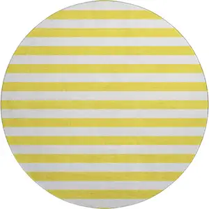 Photo of 8' Yellow And Ivory Striped Washable Round Rug With UV Protection