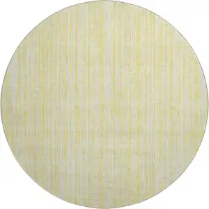 Photo of 8' Yellow And Ivory Striped Washable Round Rug With UV Protection